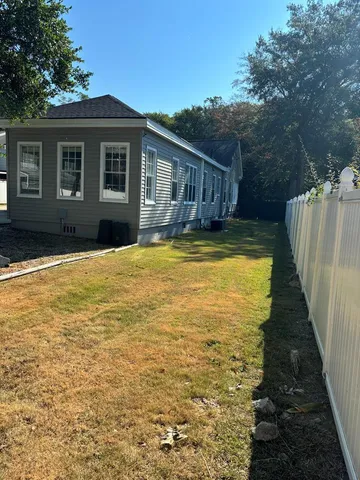 a view of a house with pool and deck