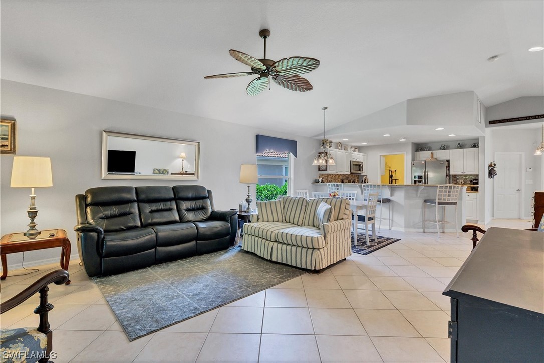 19654 Villa Rosa Loop Estero, FL 33967 - Photo 4 of 37 a living room with furniture and a chandelier