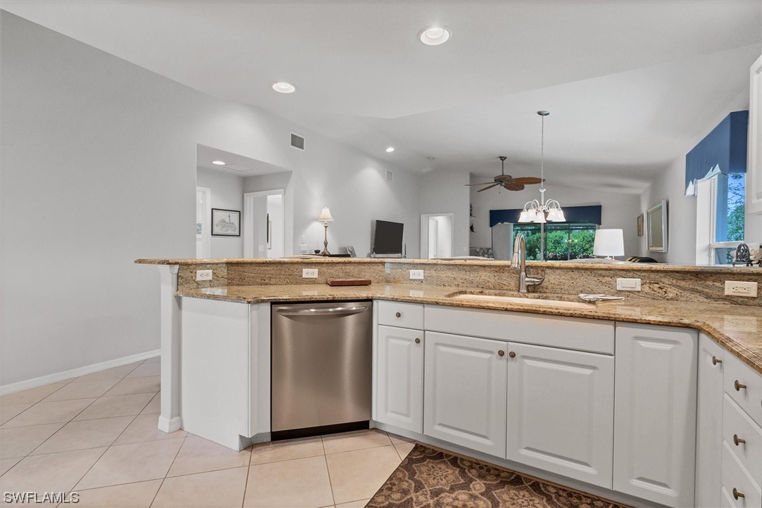 19654 Villa Rosa Loop Estero, FL 33967 - Photo 7 of 37 a kitchen with a sink and cabinets