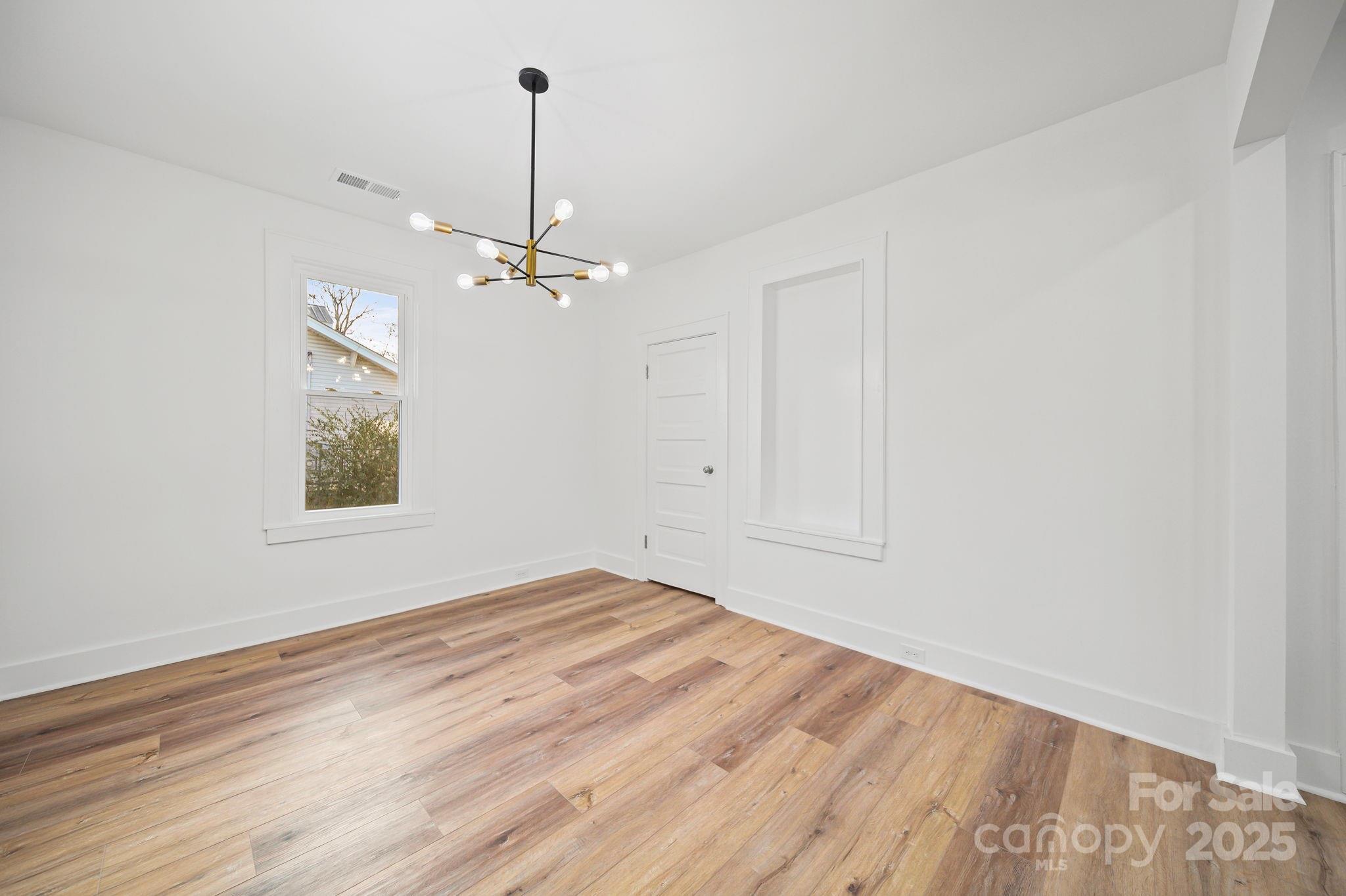 1703 Lowder Street Albemarle, NC 28001 - Photo 11 of 31 wooden floor in an empty room