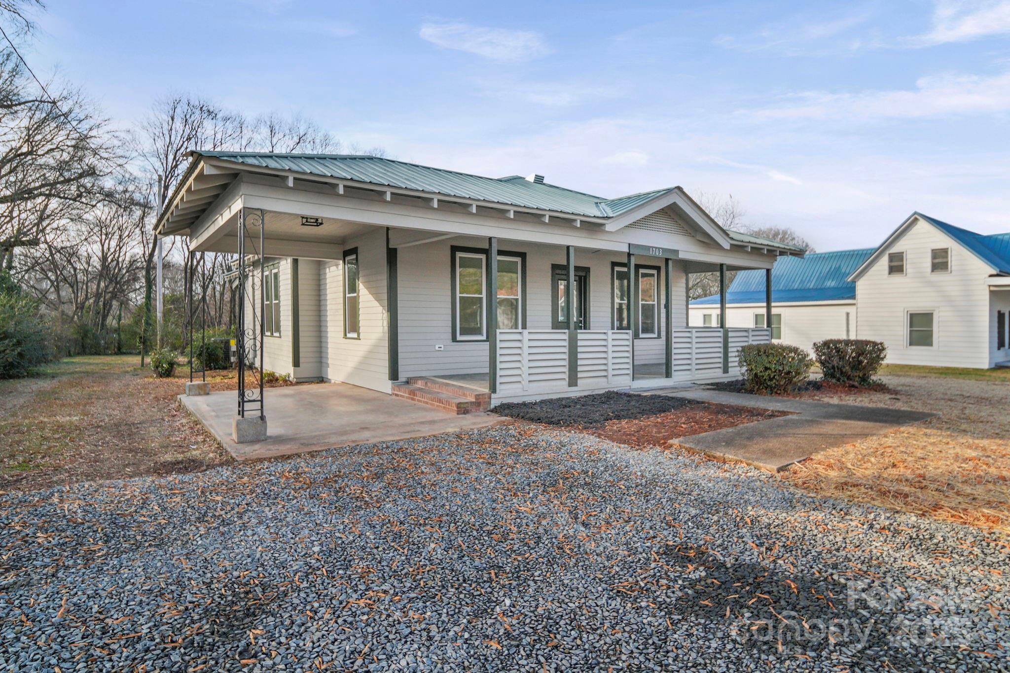 1703 Lowder Street Albemarle, NC 28001 - Photo 26 of 31 a front view of a house with a yard