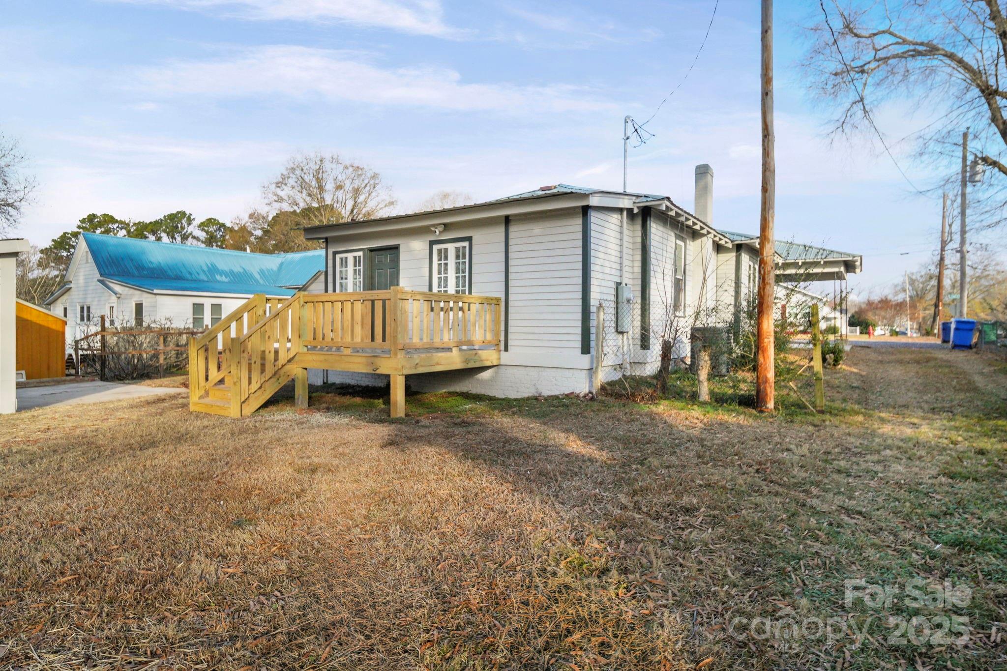 1703 Lowder Street Albemarle, NC 28001 - Photo 30 of 31 a view of a house with a yard
