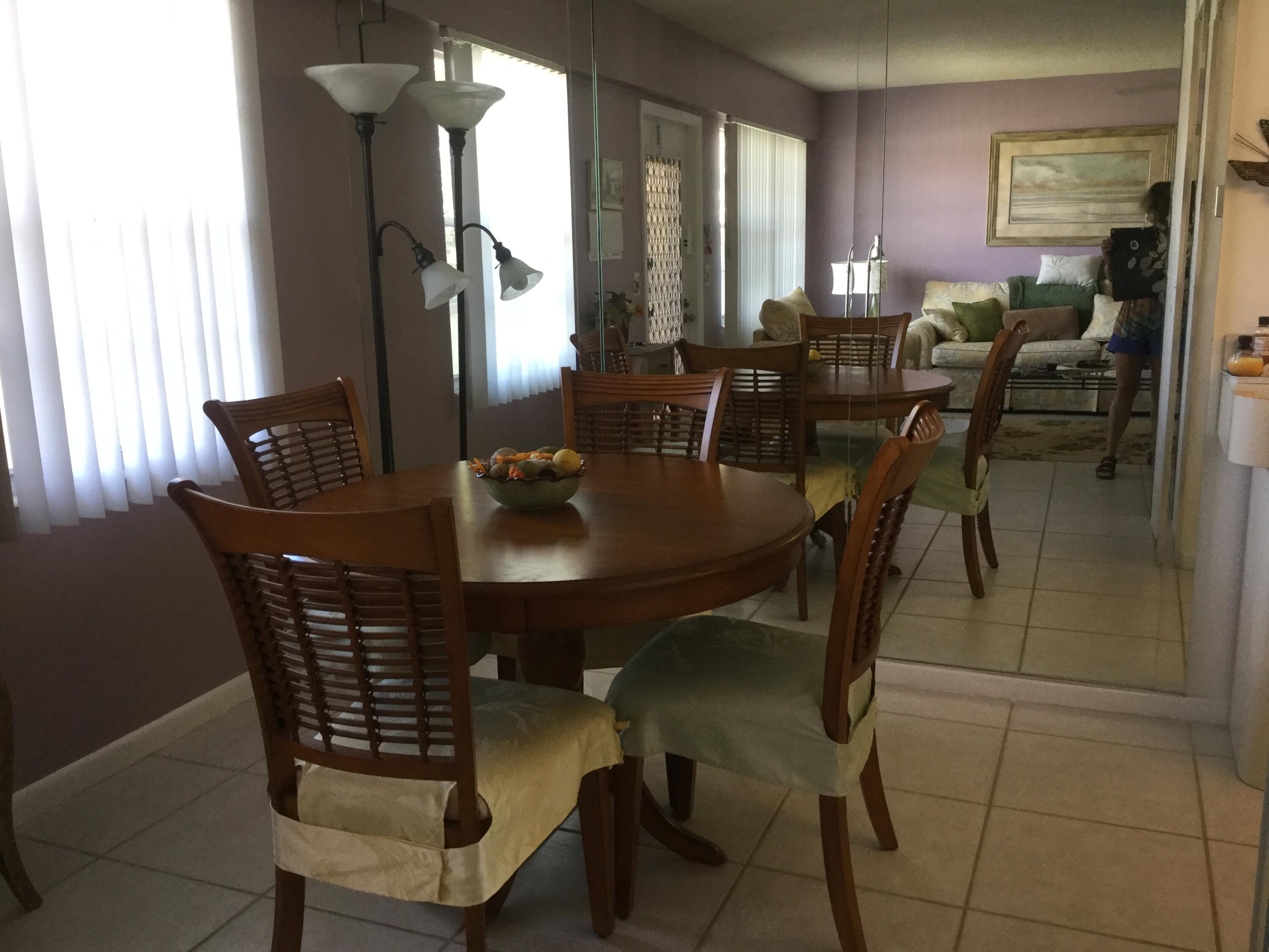 124 Dorset C, Unit 124C Boca Raton, FL 33434 - Photo 3 of 21 a dining room with furniture and window
