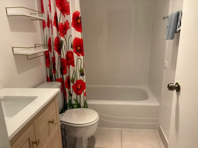 a bathroom with a toilet and a sink