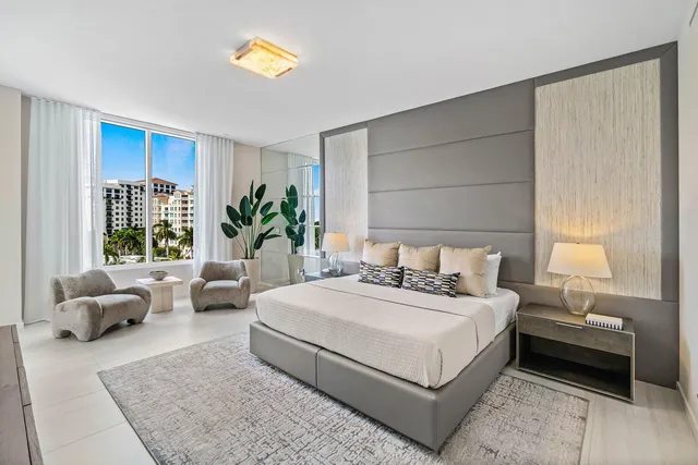 a bedroom with a bed and a couch