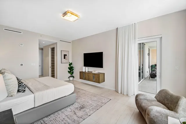 a living room with a couch and a flat screen tv