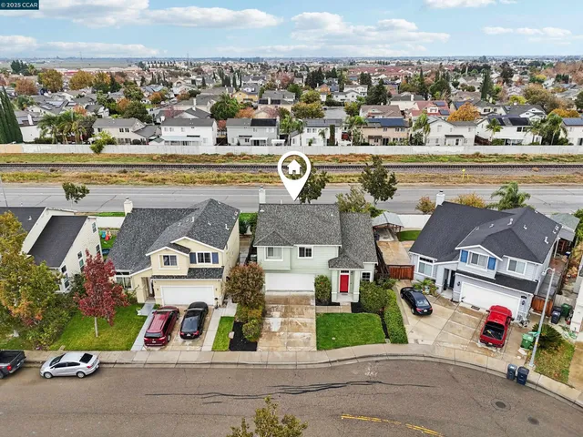 a view of multiple houses with a street