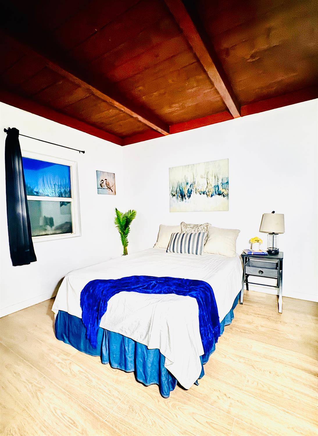 1630 Paradise Road Modesto, CA 95358 - Photo 19 of 42 a bedroom with a large bed and a potted plant