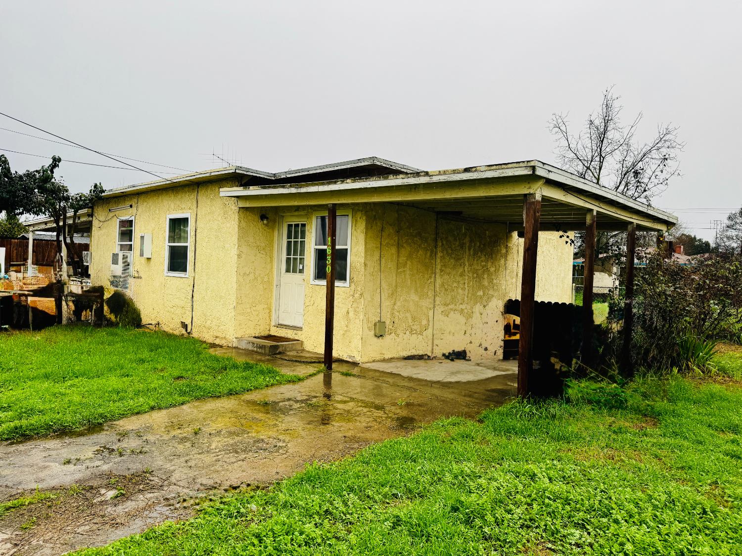 1630 Paradise Road Modesto, CA 95358 - Photo 23 of 42 view of home's exterior with a carport.