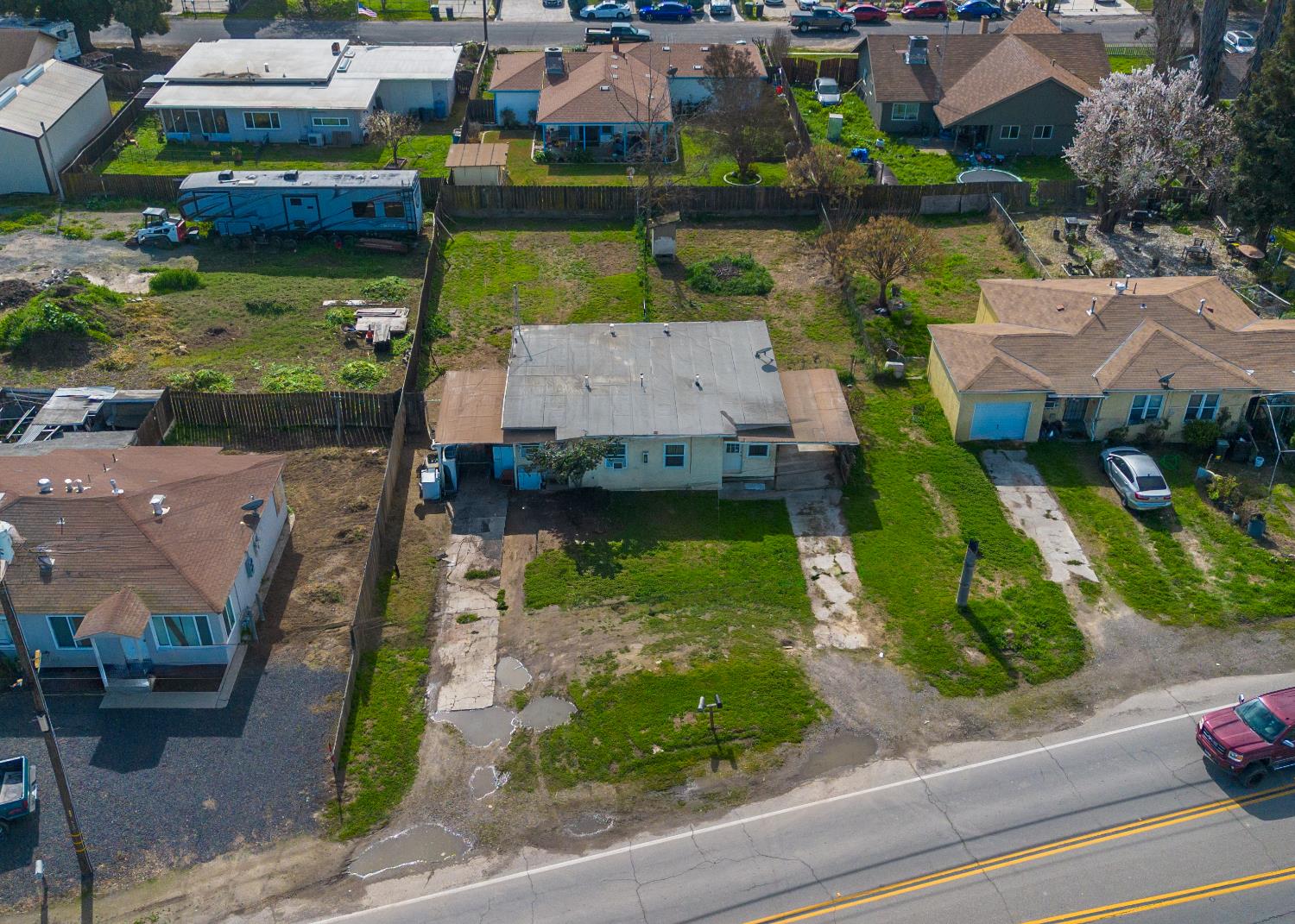 1630 Paradise Road Modesto, CA 95358 - Photo 35 of 42 an aerial view of a house with a garden and lake view