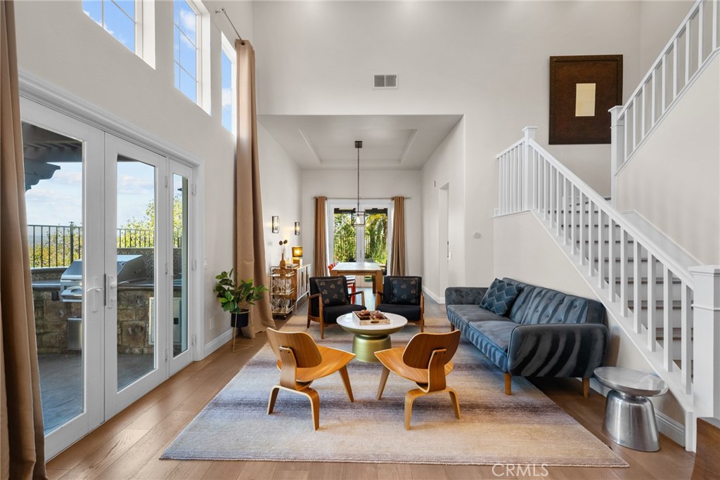 25742 Lewis Way Stevenson Ranch, CA 91381 - Photo 11 of 66 a living room with furniture and wooden floor