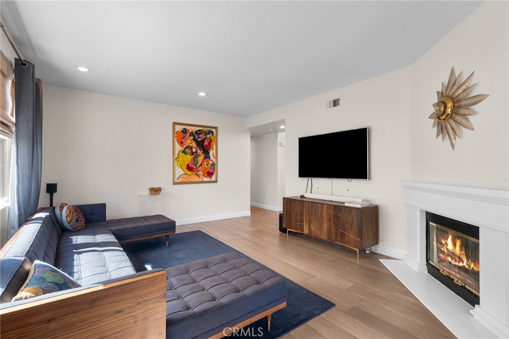 25742 Lewis Way Stevenson Ranch, CA 91381 - Photo 20 of 66 a living room with furniture and a flat screen tv