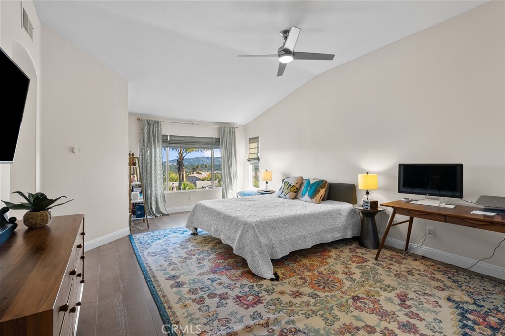 25742 Lewis Way Stevenson Ranch, CA 91381 - Photo 28 of 66 a bedroom with a bed and wooden floor