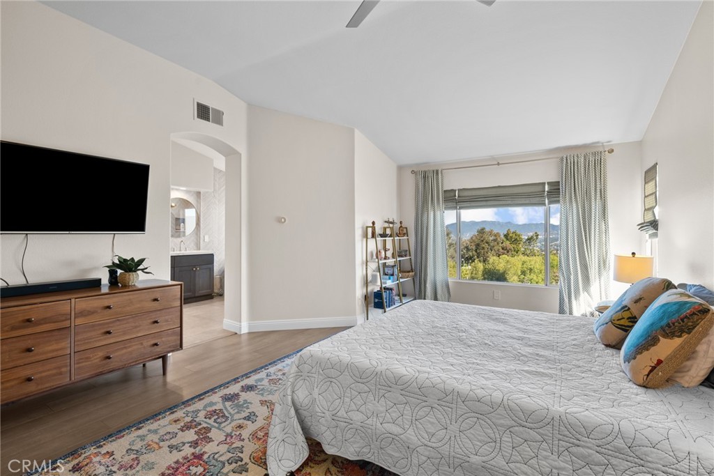 25742 Lewis Way Stevenson Ranch, CA 91381 - Photo 29 of 66 a bedroom with a bed and flat screen tv