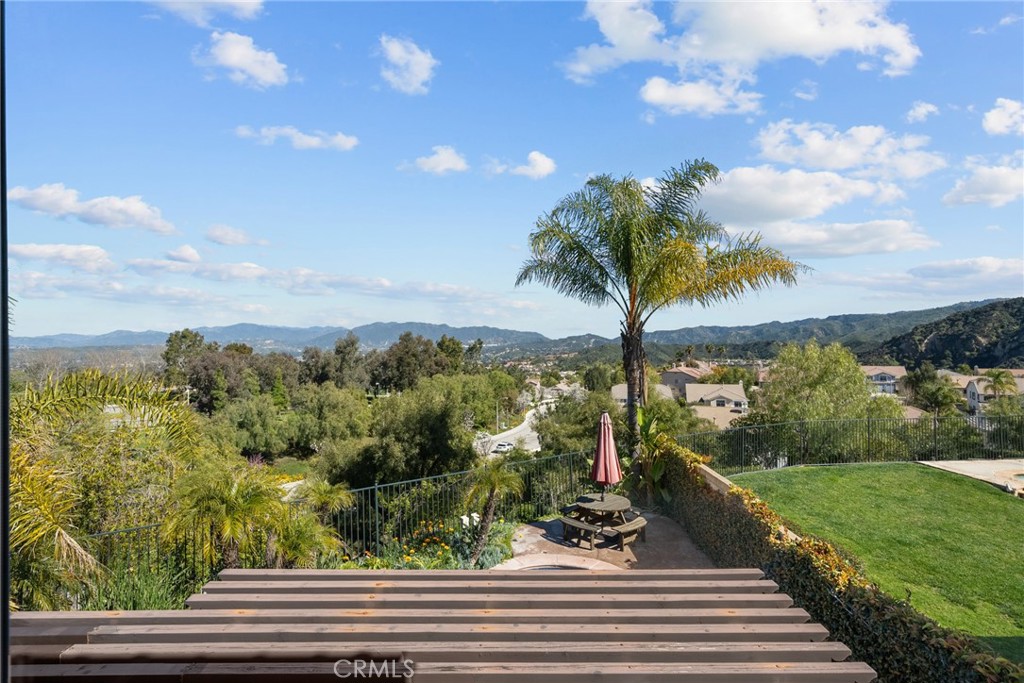 25742 Lewis Way Stevenson Ranch, CA 91381 - Photo 30 of 66 a view of a garden with a tree in the background