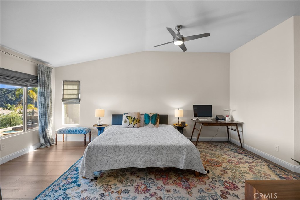 25742 Lewis Way Stevenson Ranch, CA 91381 - Photo 31 of 66 a bedroom with a bed a couch and a large window