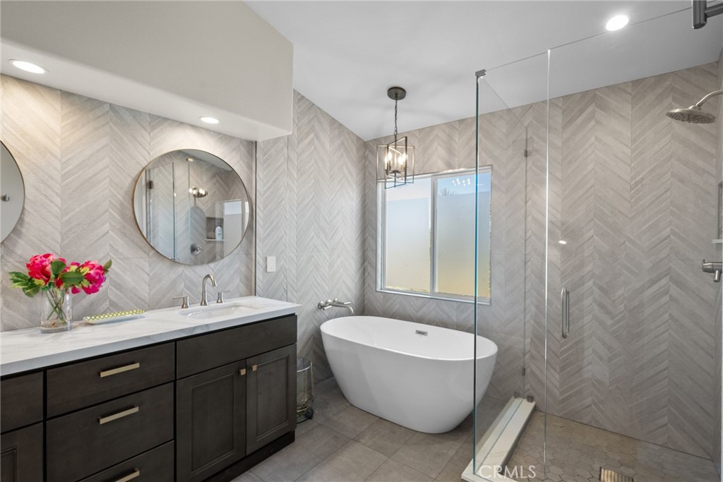 25742 Lewis Way Stevenson Ranch, CA 91381 - Photo 34 of 66 a bathroom with a double vanity sink mirror and bathtub