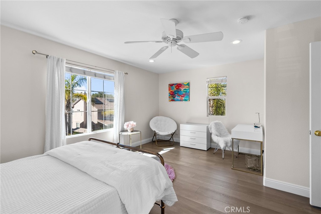 25742 Lewis Way Stevenson Ranch, CA 91381 - Photo 40 of 66 a bedroom with a bed and wooden floor