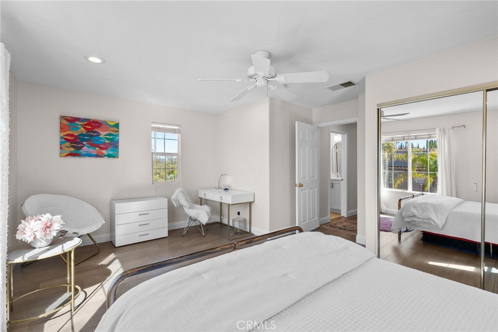 25742 Lewis Way Stevenson Ranch, CA 91381 - Photo 41 of 66 a bedroom with a bed and wooden floor