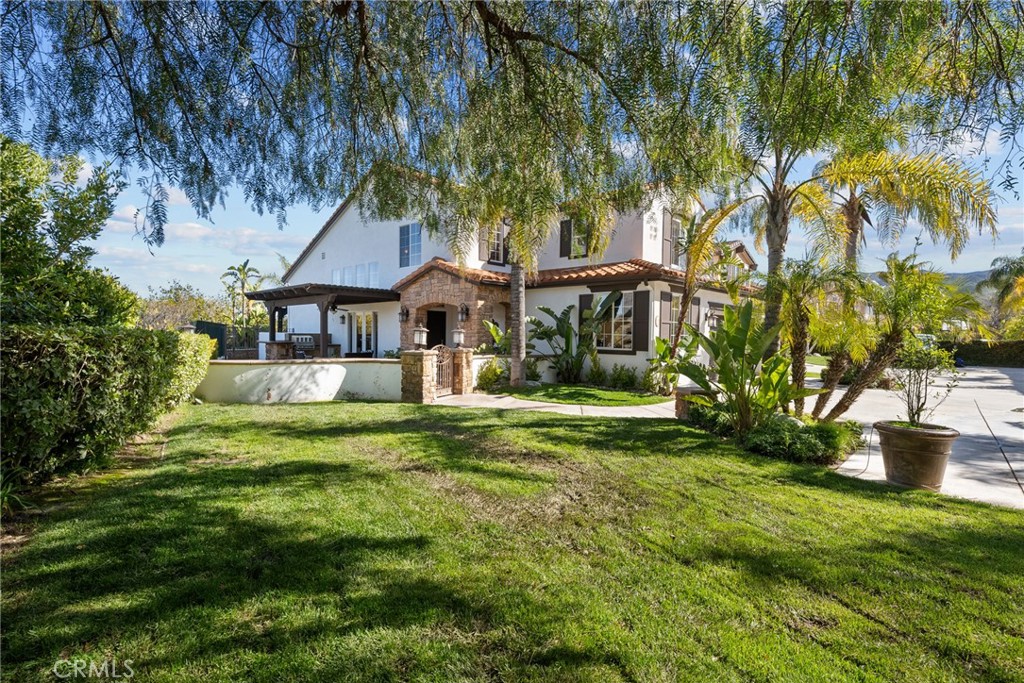 25742 Lewis Way Stevenson Ranch, CA 91381 - Photo 5 of 66 a front view of a house with a garden