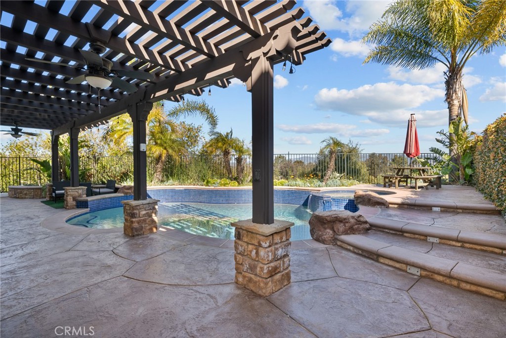25742 Lewis Way Stevenson Ranch, CA 91381 - Photo 52 of 66 a patio with swimming pool table and chairs