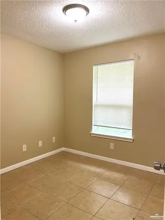 a bathroom with a granite countertop toilet and a shower