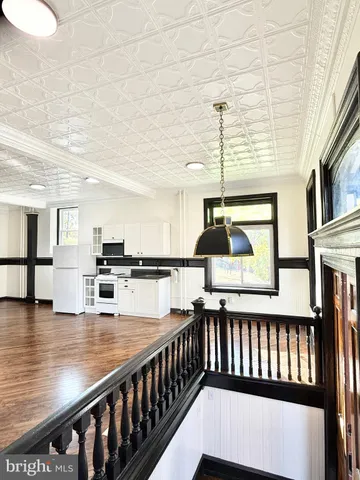 a view of a living room and kitchen floor