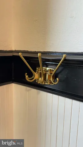 a view of kitchen with kitchen island a sink and wooden floor