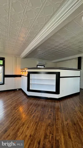 a view of a kitchen with a sink and cabinets