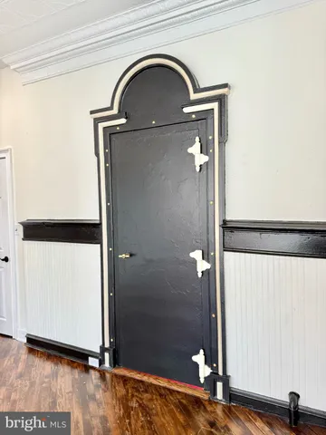 a kitchen with kitchen island granite countertop white cabinets and white appliances