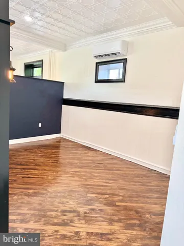 a view of a livingroom with wooden floor