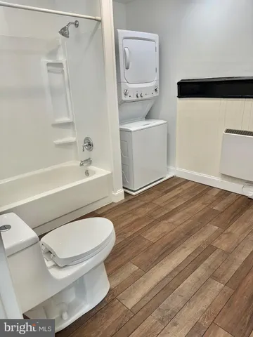 a view of a porch with wooden floor and a floor to ceiling window