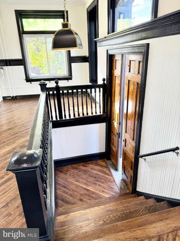 a view of entryway with wooden floor