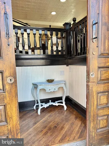 a view of a room with lots of wooden furniture