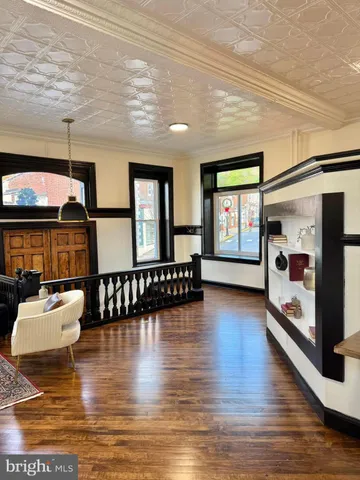 a living room with fireplace furniture and a flat screen tv