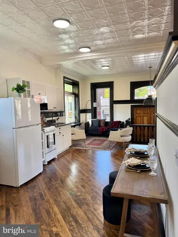 a room with furniture or kitchen view and a wooden floor