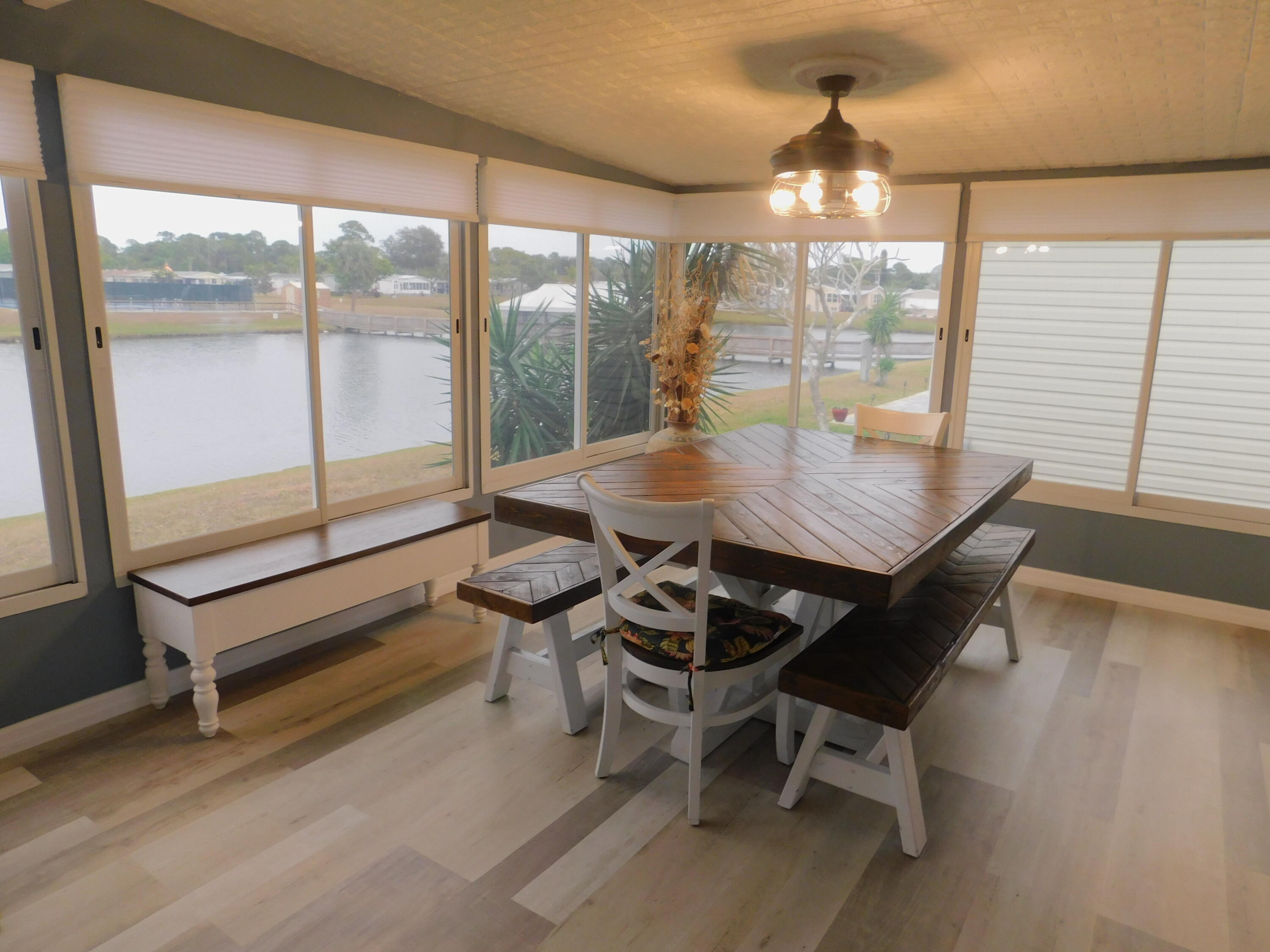 529 Hemingway Terrace, Unit 8 Fort Pierce, FL 34982 - Photo 11 of 24 a view of a dining room with furniture and wooden floor
