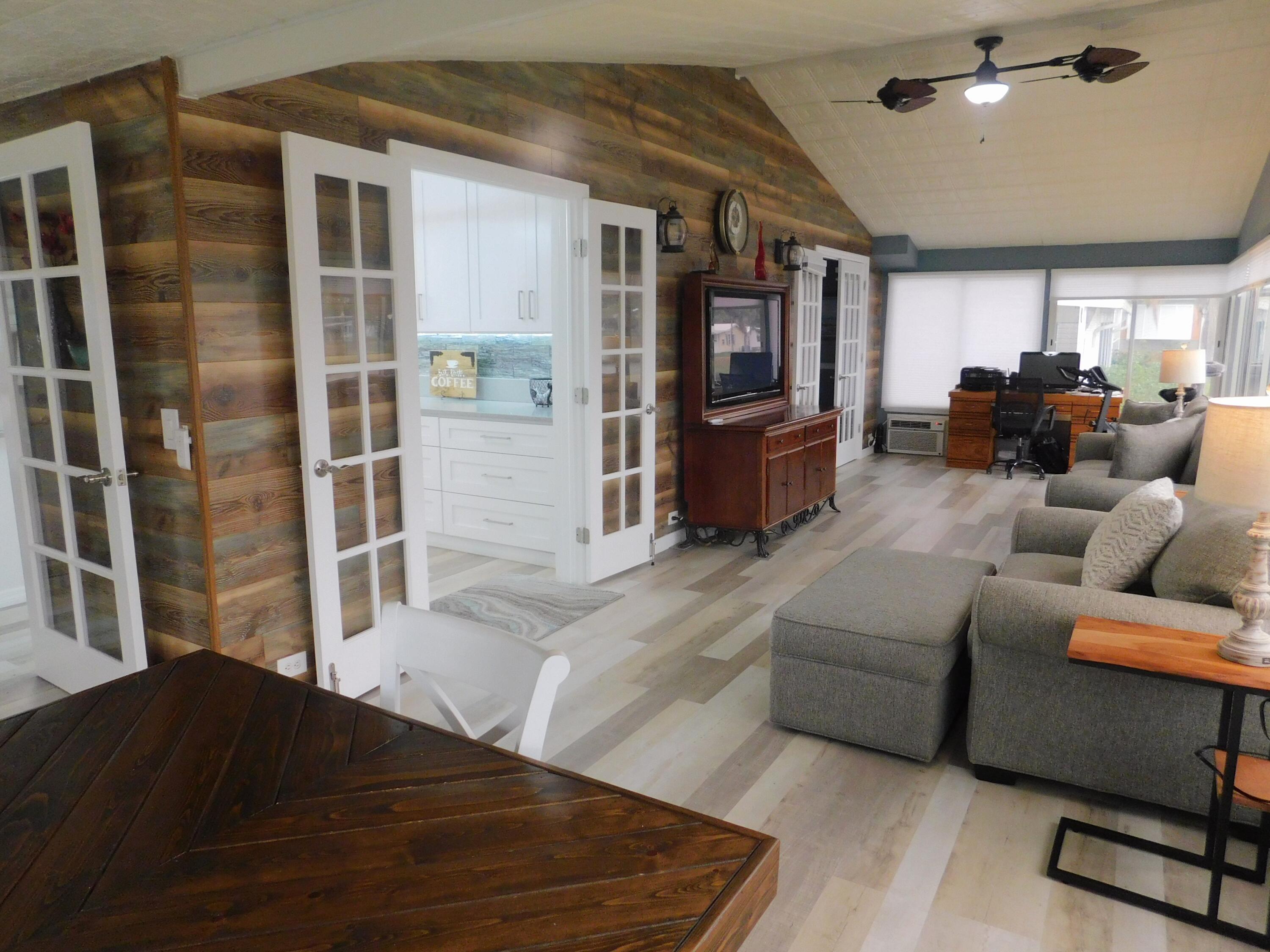 529 Hemingway Terrace, Unit 8 Fort Pierce, FL 34982 - Photo 14 of 24 a living room with furniture and a window