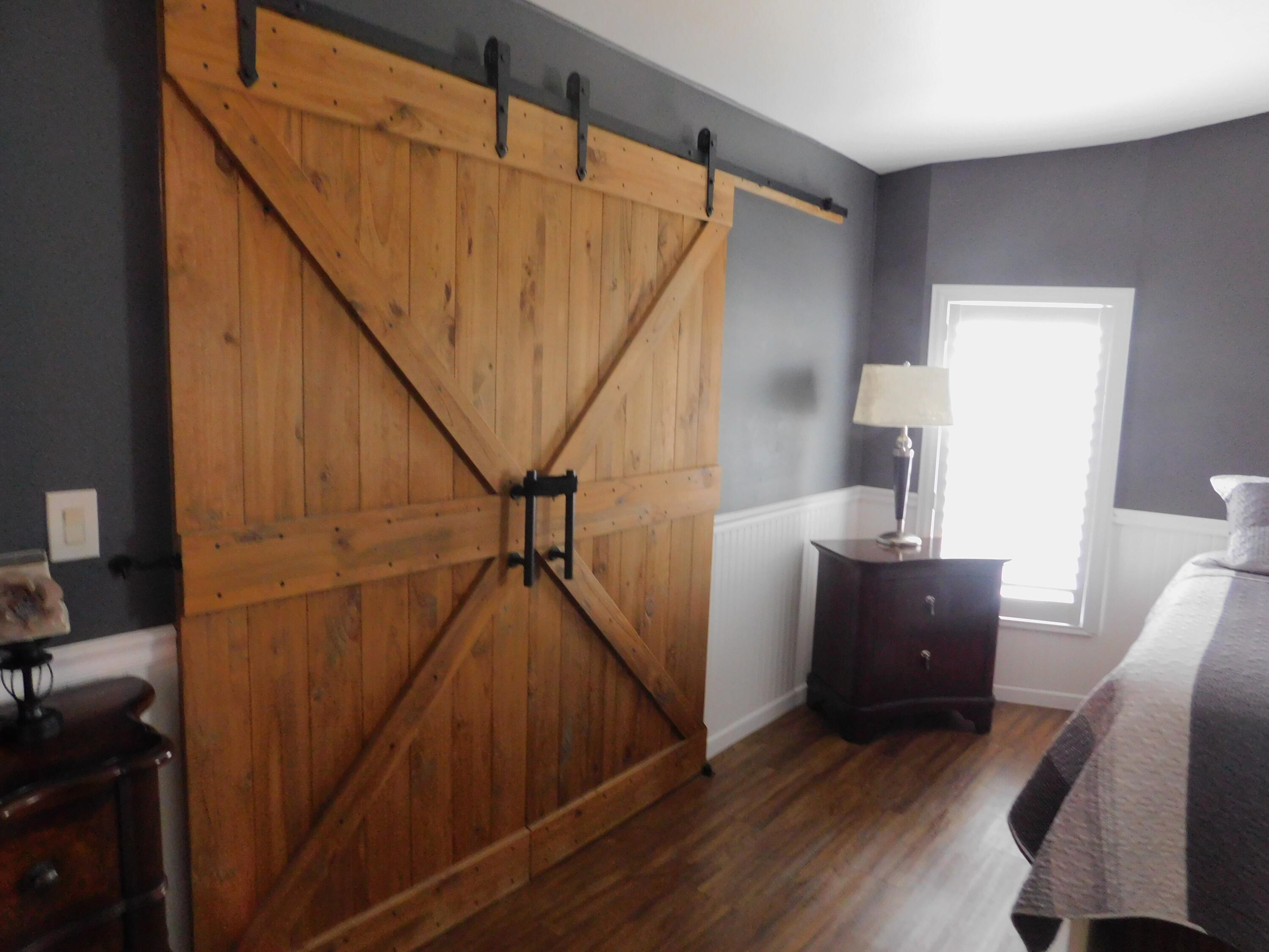 529 Hemingway Terrace, Unit 8 Fort Pierce, FL 34982 - Photo 17 of 24 a view of entryway and hall with wooden floor