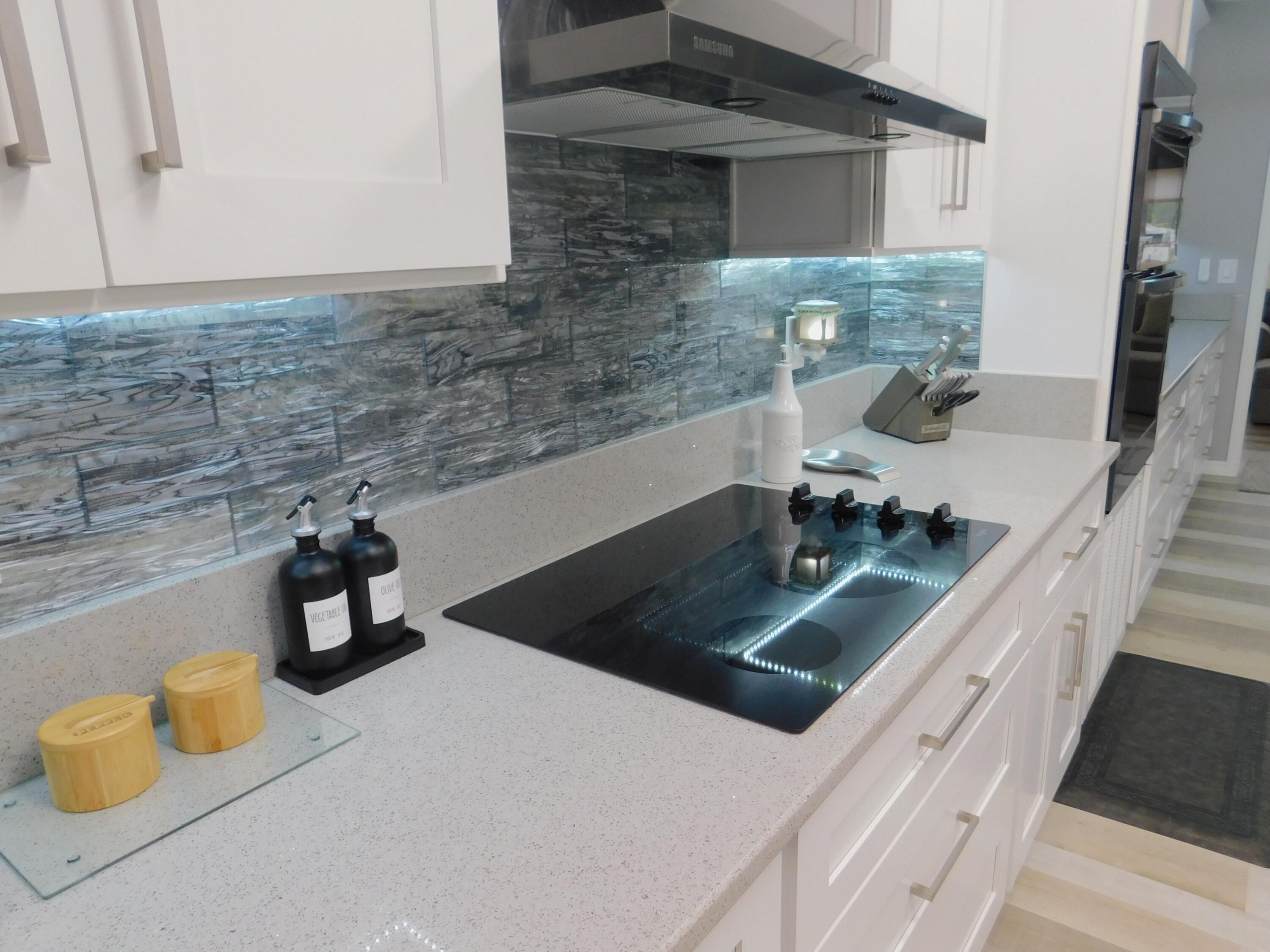 529 Hemingway Terrace, Unit 8 Fort Pierce, FL 34982 - Photo 4 of 24 a kitchen with a sink and a stove top oven