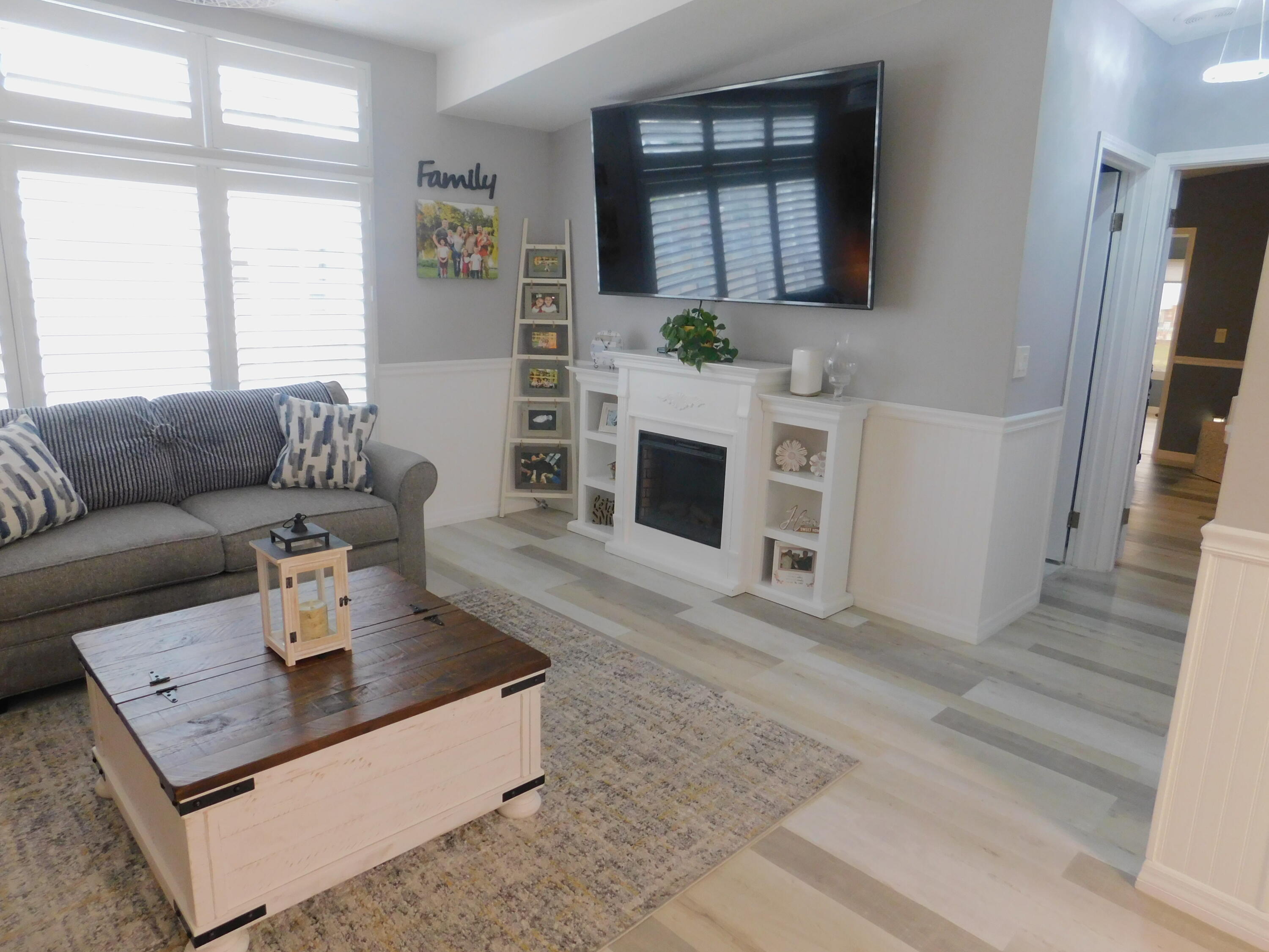 529 Hemingway Terrace, Unit 8 Fort Pierce, FL 34982 - Photo 7 of 24 a living room with furniture and a fireplace