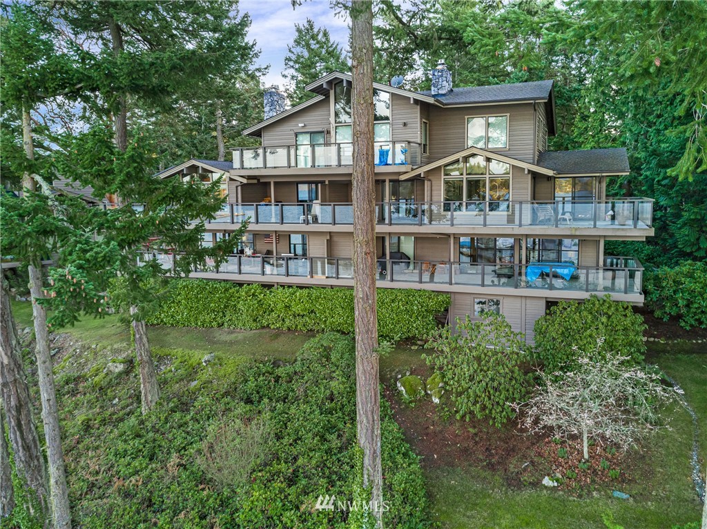 184 Armadale Road, Unit 5 Friday Harbor, WA 98250 - Photo 22 of 23 a front view of a house with a yard and potted plants