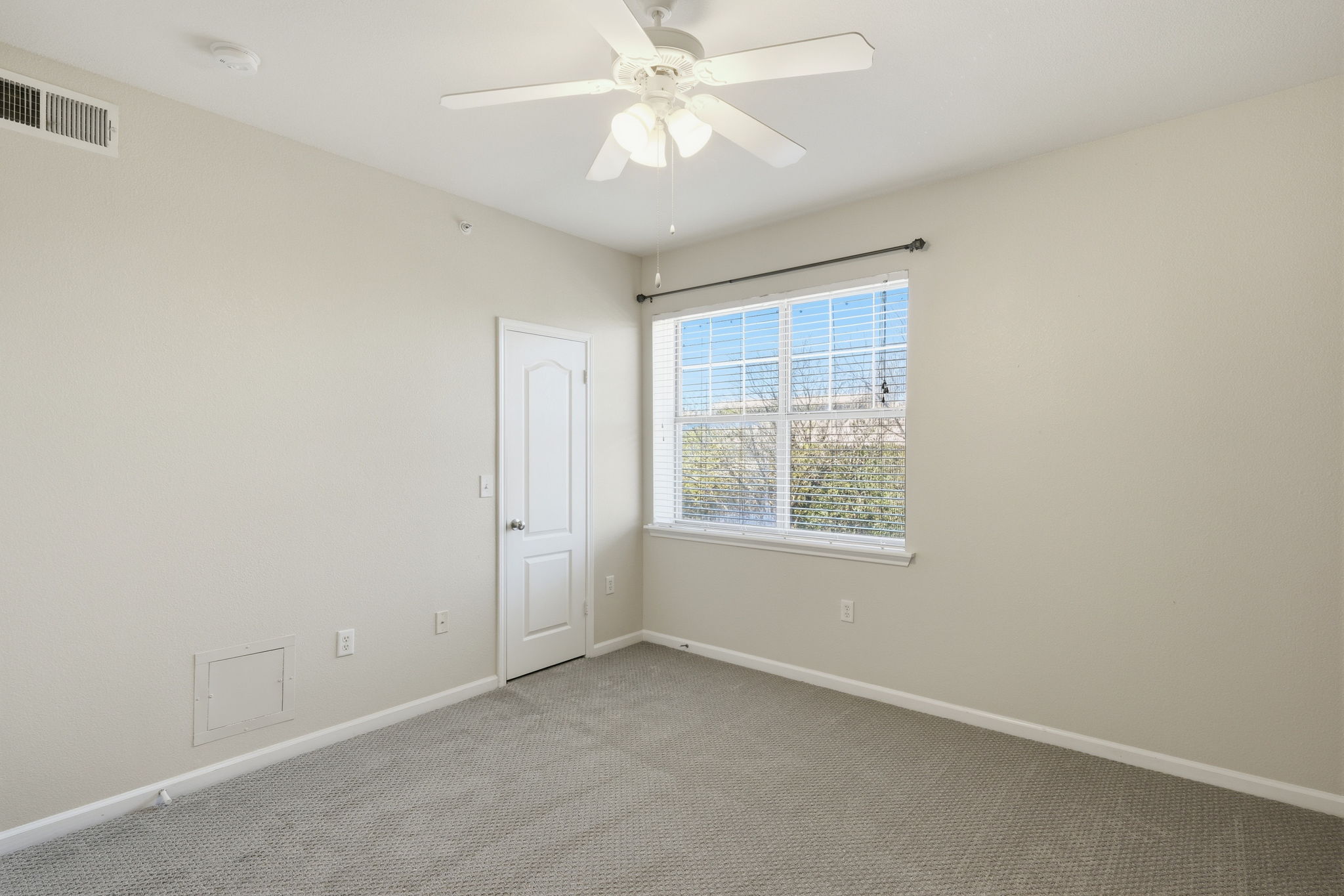 11203 Ranch Road 2222, Unit 2305 Austin, TX 78732 - Photo 11 of 19 Carpeted empty room with baseboards and a ceiling fan