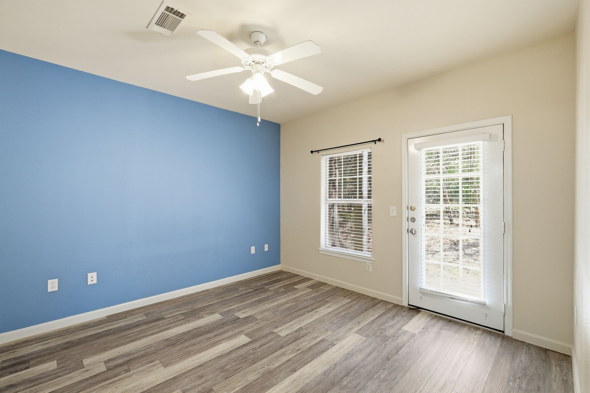 11203 Ranch Road 2222, Unit 2305 Austin, TX 78732 - Photo 9 of 19 Empty room featuring light wood-style floors and a ceiling fan