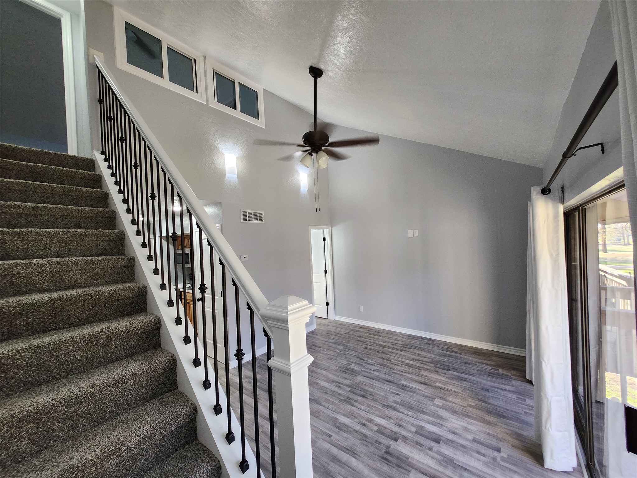 12900 Walden Road, Unit 314C Montgomery, TX 77356 - Photo 12 of 20 a view of a hallway with wooden floor and staircase