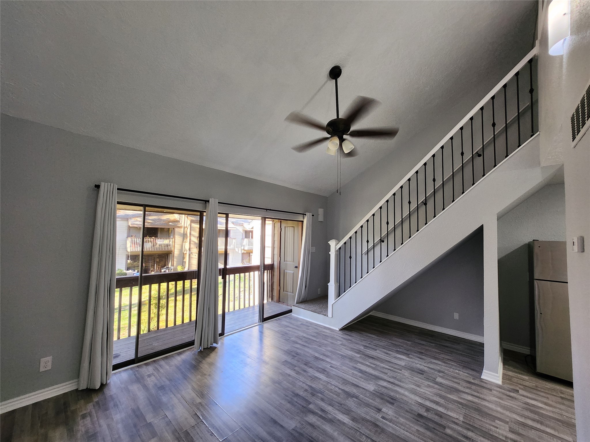 12900 Walden Road, Unit 314C Montgomery, TX 77356 - Photo 5 of 20 a view of room with hardwood floor and windows