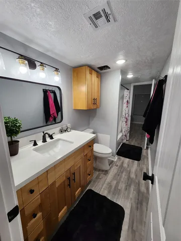 a bathroom with a sink double vanity and a mirror