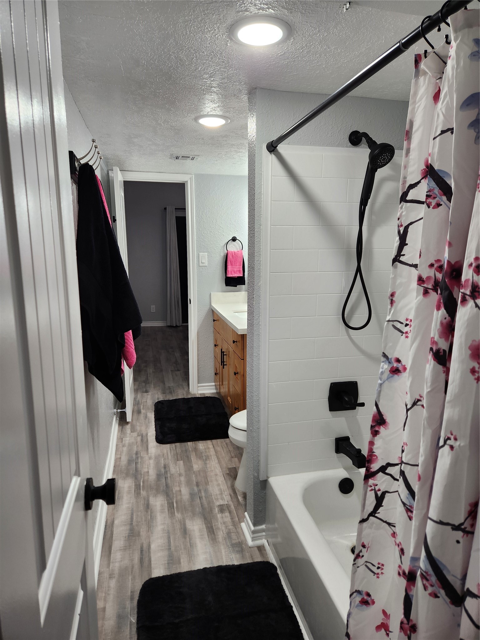 12900 Walden Road, Unit 314C Montgomery, TX 77356 - Photo 7 of 20 a bathroom with a bathtub and a shower