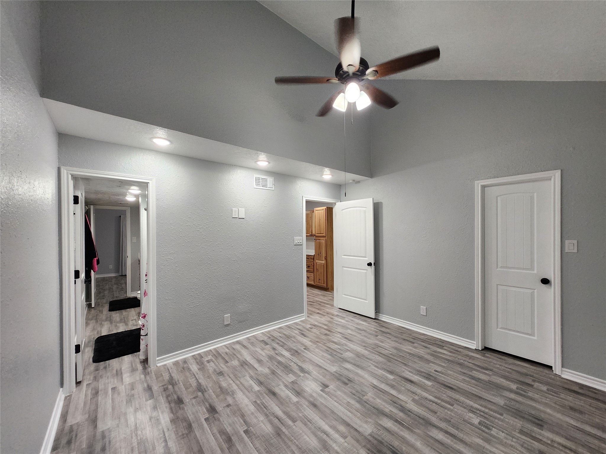 12900 Walden Road, Unit 314C Montgomery, TX 77356 - Photo 8 of 20 a view of an empty room with wooden floor