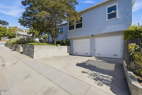 a front view of a house with a garage